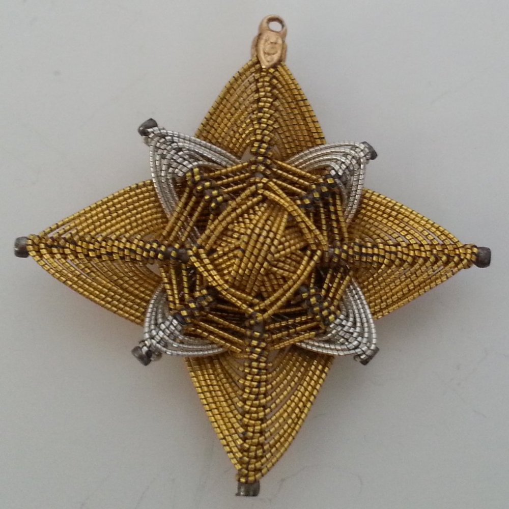 Artisan made silver and gold OJO pndant